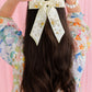 BRIANNA CANNON DAISY BOW BARRETTE